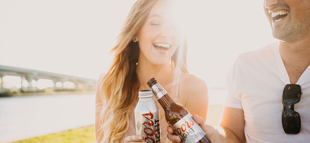 Man and woman drinking Coors Light
